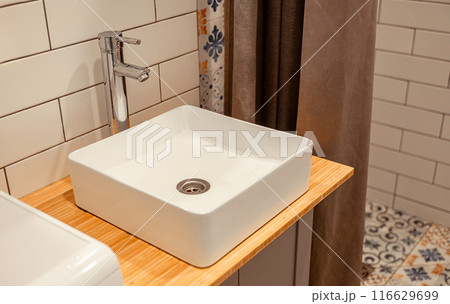 white rectangular sink and faucet in the bathroom white rectangular sink and faucet in the bathroom 116629699