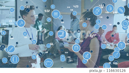 Image of network of icons over two caucasian women discussing while having coffee at office Image of network of icons over two caucasian women discussing while having coffee at office 116630126