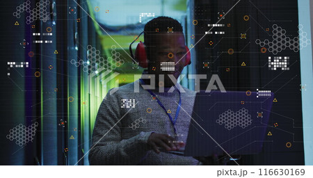 Image of data processing over african american male engineer using laptop at server room 116630169