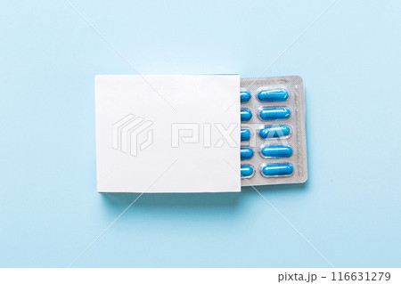 Blank White Product Package Box Mock-up. Open blank medicine drug box with blue pills blister top view 116631279