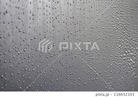 Water droplets on raining day with dark cover background. Water droplets concept 116632101