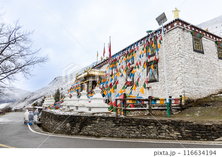 Hikers in Changping valley Sichuan China to appreciate the four sisters mountains would pass through the Lama Temple Hikers in Changping valley Sichuan China to appreciate the four sisters mountains would pass through the Lama Temple 116634194
