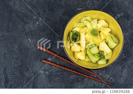 pineapple and cucumber salad. pineapple and cucumber salad. 116634288