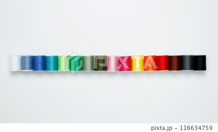 Multicolored sewing threads on white background. Top view, copy space 116634759