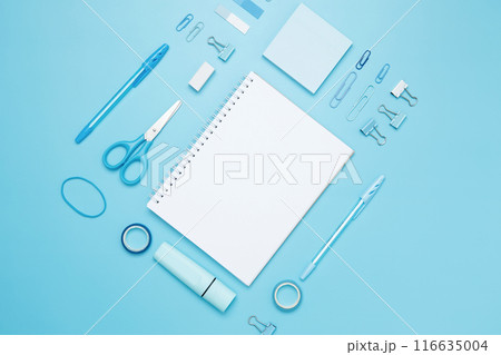 Creative flat lay mockup design of workspace. Top view composition with white notebook, to do list and stationery on blue background Creative flat lay mockup design of workspace. Top view composition with white notebook, to do list and stationery on blue background 116635004