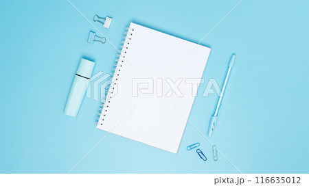 Creative flat lay mockup design of workspace. Top view composition with white notebook, to do list and stationery on blue background Creative flat lay mockup design of workspace. Top view composition with white notebook, to do list and stationery on blue background 116635012