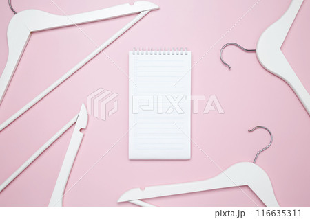 Creative flat lay hangers. Mockup to do list. Sale discount store promo shopping concept. Top view. Copy space 116635311