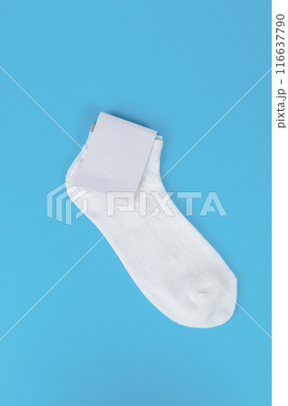 White pair of short socks on blue background. Socks with white label for your design. Mock up, template, copy space 116637790