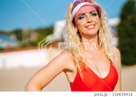 Three young woman in bright swimsuits dancing. Sport, summer, fitness, urban culture concept. Three young woman in bright swimsuits dancing. Sport, summer, fitness, urban culture concept. 116639418