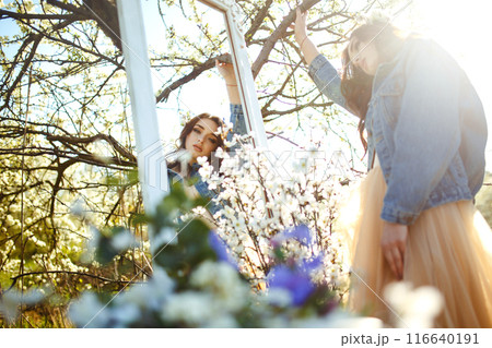 Portrait of a beautiful bride. Wedding concept. Stylish wedding. Great sunset light. Spring garden. Portrait of a beautiful bride. Wedding concept. Stylish wedding. Great sunset light. Spring garden. 116640191