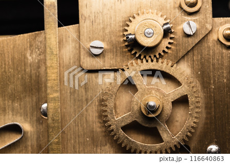 Vintage clock details close-up photo with selective focus, gears 116640863