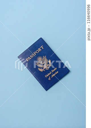 United states of america passport on a blue background United states of america passport on a blue background 116640996