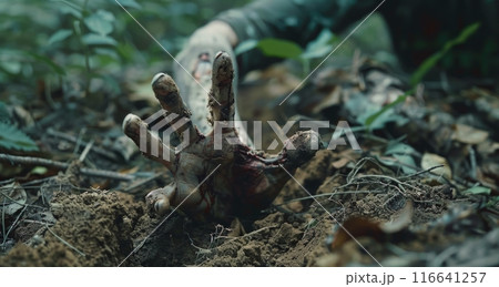 A Bloody Hand Emerges From The Forest Floor 116641257