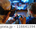 Virtual Reality Gaming: Grandfather and Grandson Bonding with VR Controller in Hand 116641394