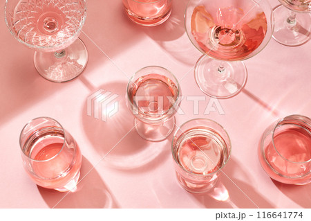 various glasses on pink background 116641774