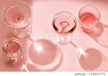 various glasses on pink background various glasses on pink background 116641775