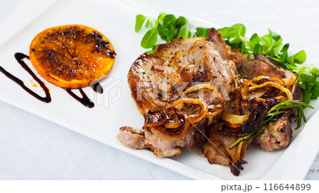 Pork steak served with greens Pork steak served with greens 116644899