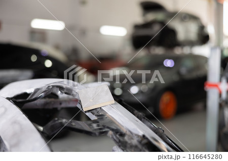 Polishing sponge lies on part of car Polishing sponge lies on part of car 116645280