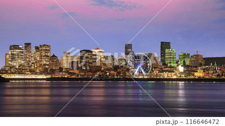 Montreal skyline and St Lawrence River at dusk with pink sky background, Quebec, Canada 116646472