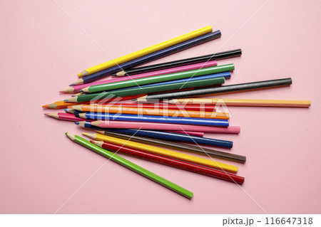 A row of colorful pencils on a pink background 116647318