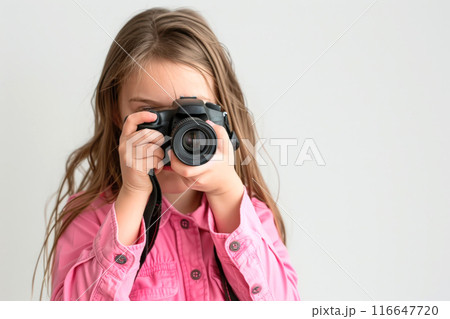 a girl photographer holding DSLR camera take photo , word international photo day concept 116647720