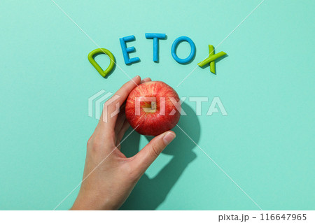 The word "detox" is made of colored plasticine on a turquoise background. 116647965