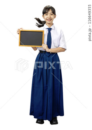 Portrait of an Asian Junior High School student girl in white and blue uniform standing while showing blank small blackboard Portrait of an Asian Junior High School student girl in white and blue uniform standing while showing blank small blackboard 116649355