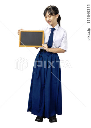 Portrait of an Asian Junior High School student girl in white and blue uniform standing while showing blank small blackboard Portrait of an Asian Junior High School student girl in white and blue uniform standing while showing blank small blackboard 116649356