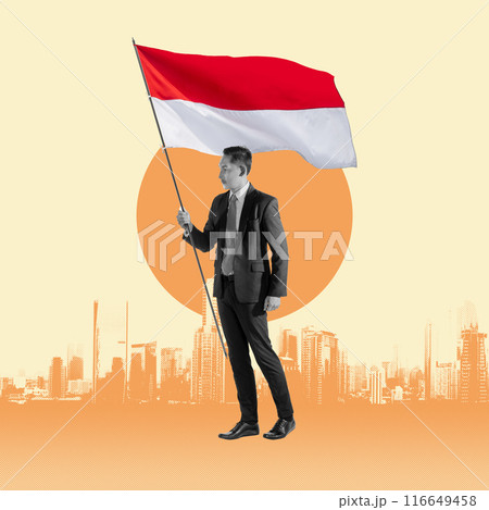 Businessman standing while holding the Indonesia flag Businessman standing while holding the Indonesia flag 116649458