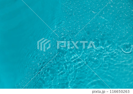 Serene Aquatic Ripples Close-up of bubbles in bright turquoise water. 116650263