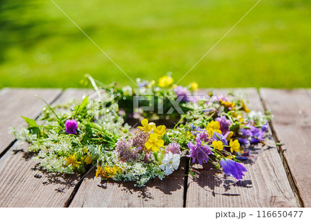 Midsummer background. Summer Flower Wreath 116650477