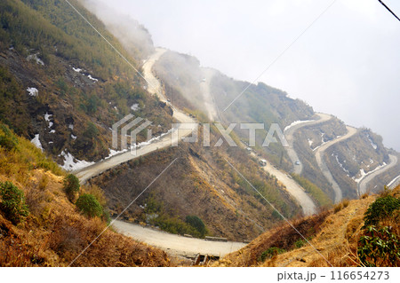 SNOW DEPOSITED BESIDE THE ROAD SIDE OF ZIG ZAG ROAD IN SILK ROUTE EAST SIKKIM 116654273