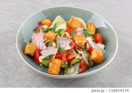 squash salad and halloumi cheese with sesame seeds against a stone background, studio food photo 2 116654374