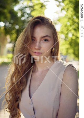 a beautiful teenage girl in a peach fuzz suit with a waistcoat, in the style of old money walks through the morning city a beautiful teenage girl in a peach fuzz suit with a waistcoat, in the style of old money walks through the morning city 116654923