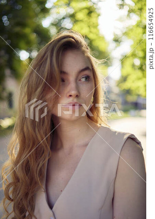 a beautiful teenage girl in a peach fuzz suit with a waistcoat, in the style of old money walks through the morning city a beautiful teenage girl in a peach fuzz suit with a waistcoat, in the style of old money walks through the morning city 116654925