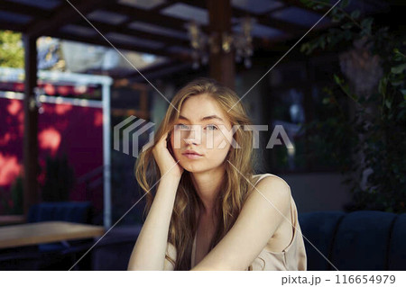 a beautiful teenage girl in a peach fuzz suit with a vest, in the old money style in a fancy restaurant a beautiful teenage girl in a peach fuzz suit with a vest, in the old money style in a fancy restaurant 116654979