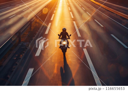 Motorcycle rider on the road in the city at sunset. Motorcycle rider on the road in the city at sunset. 116655653