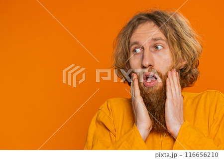 Excited amazed man surprise looking at camera with big eyes, shocked by sudden victory wow emotion 116656210