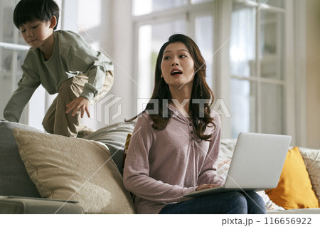 working asian mother annoyed by hyperactive child working asian mother annoyed by hyperactive child 116656922