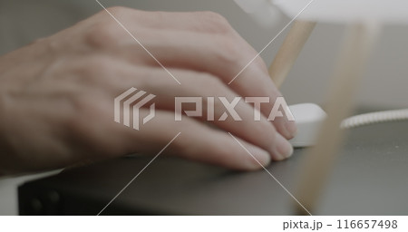 Close-up of female hand turning off light touching lamp switch on bedside table and sleeping at night. Time to sleep concept. Close-up of female hand turning off light touching lamp switch on bedside table and sleeping at night. Time to sleep concept. 116657498