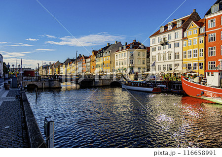 Last rays of sun on the Nyhavn harbor channel. Copenhagen Denmark. 116658991