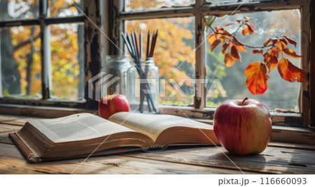 Autumnal Windowsill With Open Book, Red Apple, and Pencils Autumnal Windowsill With Open Book, Red Apple, and Pencils 116660093