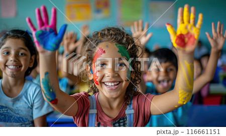 Children different races brightly painted hands raised in joy in classroom. Children laugh smile 116661151