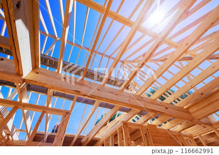 Wooden roof beam is constructed from frames of trusses rafters Wooden roof beam is constructed from frames of trusses rafters 116662991
