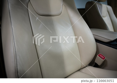 Before and after effect of cleaning leather upholstery in a car 116663051