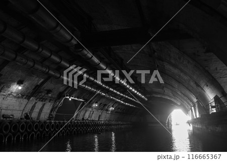 Industrial concrete tunnel perspective with glowing exit gateway Industrial concrete tunnel perspective with glowing exit gateway 116665367