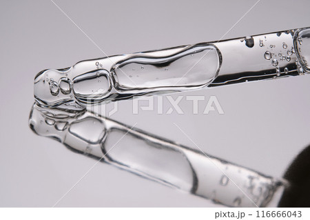 Pipette with cosmetic gel or serum close-up. 116666043