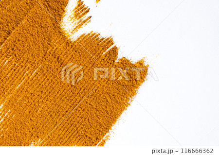 Spilled turmeric powder on white background top view, spice textures. 116666362