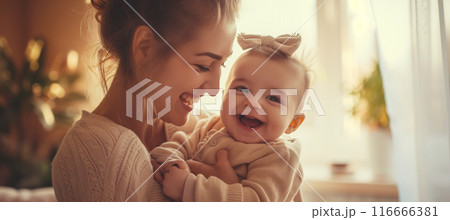 Heartwarming moment: joyful mother and baby bonding and smiling together 116666381