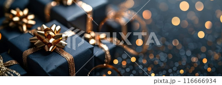 Blue Gift Boxes With Gold Ribbon and Glitter Close-Up in Festive Bokeh Setting 116666934